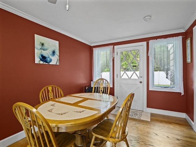 11 View St, Dracut, MA 01826 - dining room with baseboards, ornamental molding, and light wood finished floors