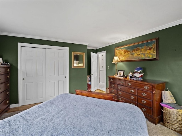 11 View St, Dracut, MA 01826 - carpeted bedroom featuring a closet, ornamental molding, and baseboards