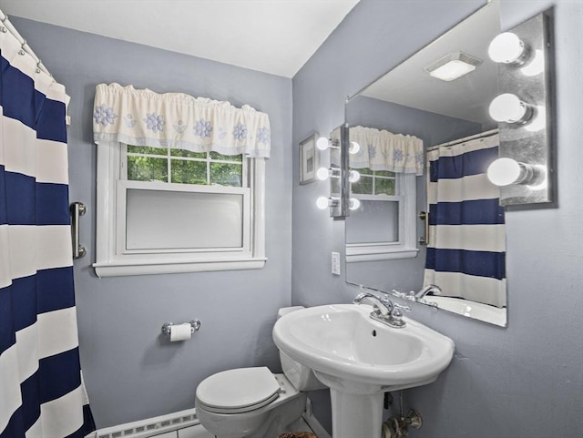 11 View St, Dracut, MA 01826 - full bathroom with a baseboard heating unit, toilet, and curtained shower