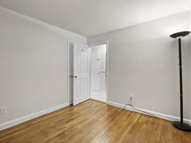 11 View St, Dracut, MA 01826 - empty room with baseboards and wood finished floors