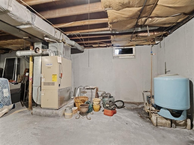 11 View St, Dracut, MA 01826 - unfinished below grade area with heating unit and a water pressure tank
