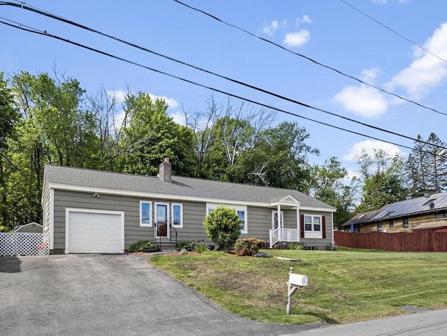 11 View St, Dracut, MA 01826 - view of front of home featuring a garage, driveway, and a chimney