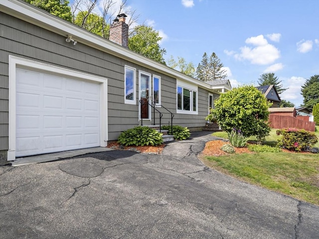 11 View St, Dracut, MA 01826 - single story home featuring an attached garage, a chimney, and entry steps
