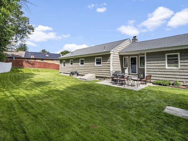 11 View St, Dracut, MA 01826 - rear view of property with a patio area, a chimney, and a shingled roof