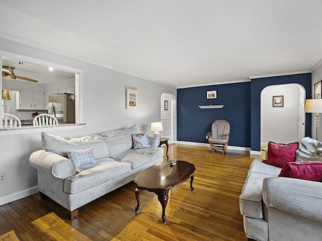 11 View St, Dracut, MA 01826 - living area with arched walkways, wood finished floors, ornamental molding, and baseboards