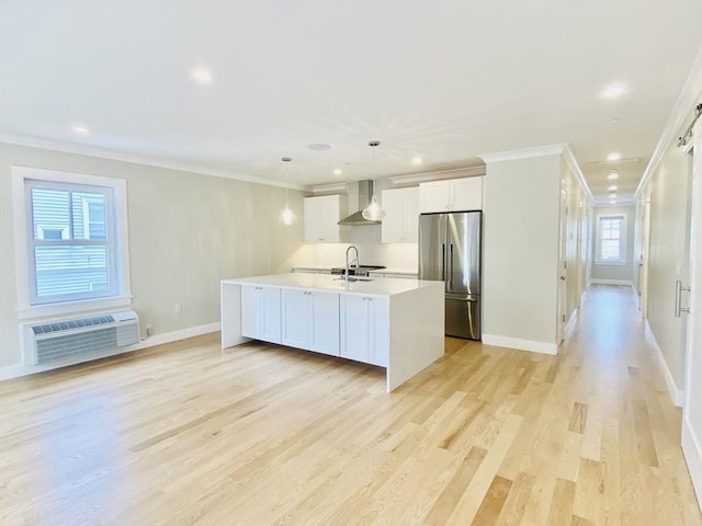 15 Yuill Cir Unit 3, Boston, MA 02136 - kitchen featuring stainless steel fridge, wall chimney exhaust hood, a wall mounted air conditioner, crown molding, and light countertops