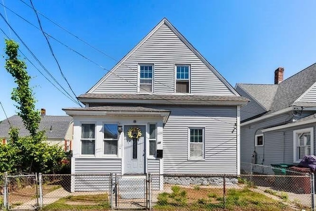 18 Anderson St, Lowell, MA 01852 - view of front of home with a gate and a fenced front yard