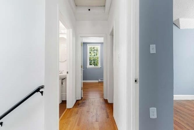 18 Anderson St, Lowell, MA 01852 - corridor featuring light wood-style floors, baseboards, and an upstairs landing