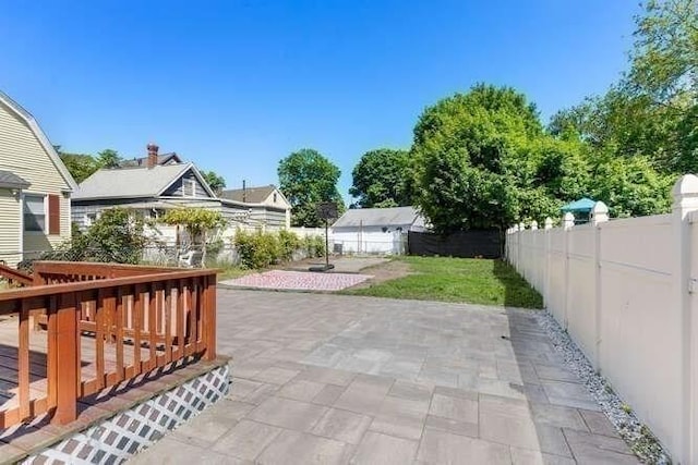18 Anderson St, Lowell, MA 01852 - fenced backyard featuring a patio area