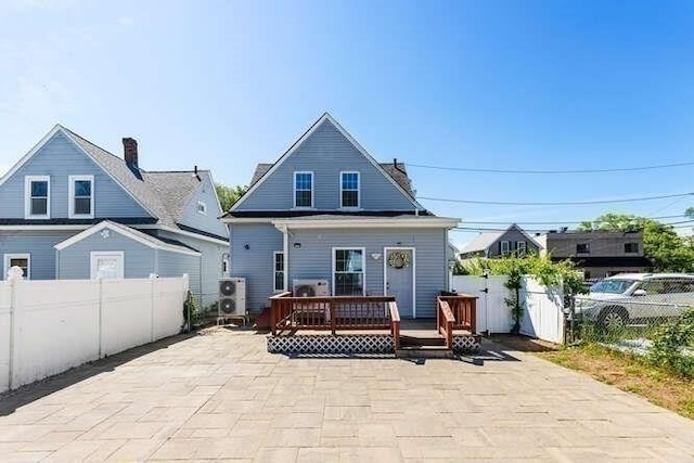18 Anderson St, Lowell, MA 01852 - rear view of property with a deck and a patio