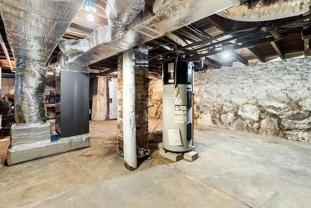 18 Anderson St, Lowell, MA 01852 - unfinished basement featuring water heater