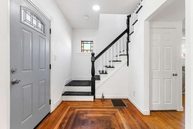 18 Anderson St, Lowell, MA 01852 - foyer entrance featuring stairway and baseboards