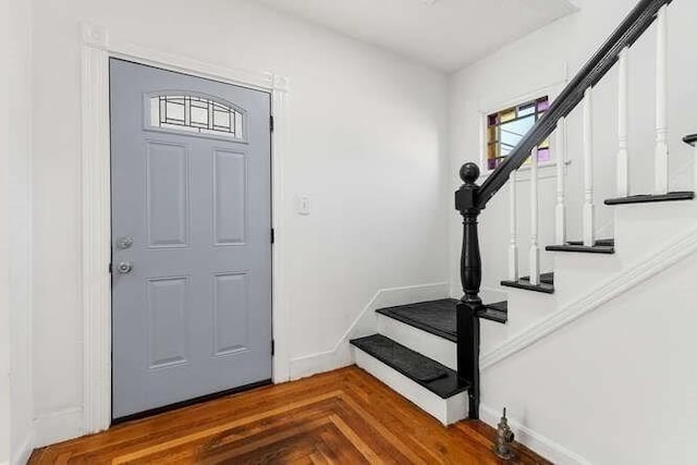 18 Anderson St, Lowell, MA 01852 - entryway featuring stairway and baseboards