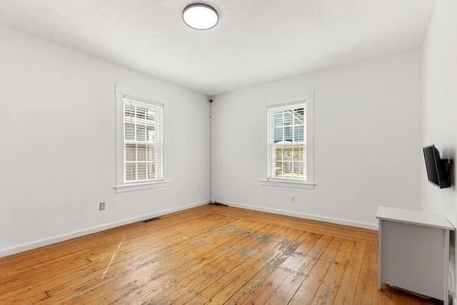 18 Anderson St, Lowell, MA 01852 - empty room featuring light wood-style floors and baseboards