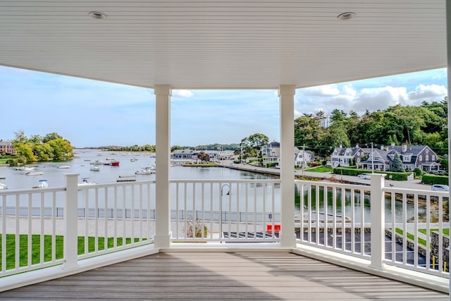 wooden deck featuring a water view