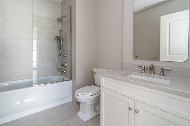 full bathroom featuring vanity, combined bath / shower with glass door, tile patterned floors, and toilet