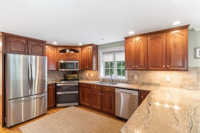 14 Cushman Lndg, Plympton, MA 02367 - kitchen with stainless steel appliances, light stone counters, decorative backsplash, recessed lighting, and light wood-type flooring