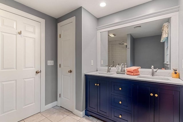 14 Cushman Lndg, Plympton, MA 02367 - bathroom with double vanity, tile patterned flooring, and a tile shower