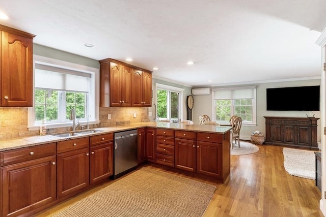 14 Cushman Lndg, Plympton, MA 02367 - kitchen featuring stainless steel dishwasher, a peninsula, a wall unit AC, decorative backsplash, and light wood-style flooring