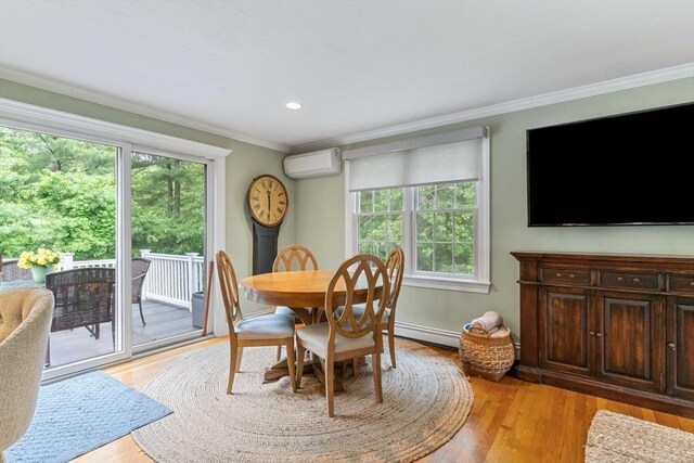 14 Cushman Lndg, Plympton, MA 02367 - dining room featuring an AC wall unit, plenty of natural light, crown molding, light wood-type flooring, and recessed lighting