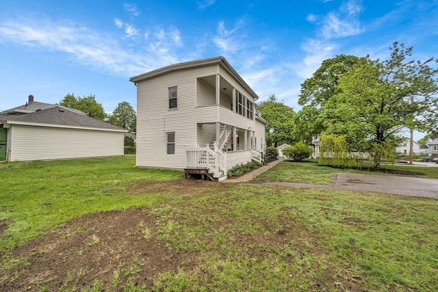 back of property with a yard