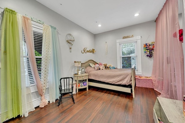 bedroom with hardwood / wood-style flooring and recessed lighting