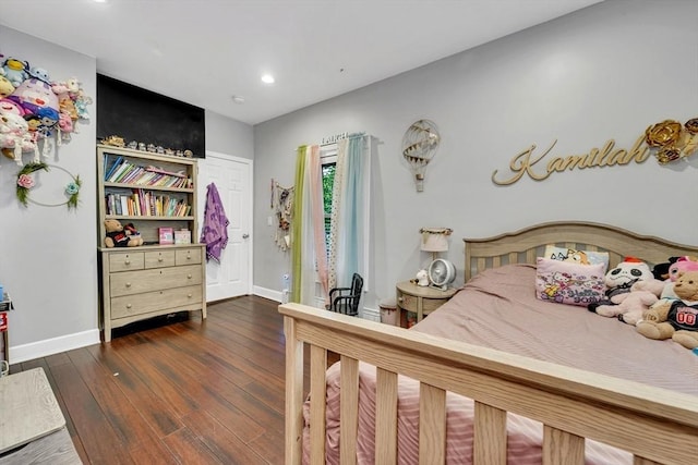 bedroom featuring baseboards, dark wood-type flooring, and recessed lighting