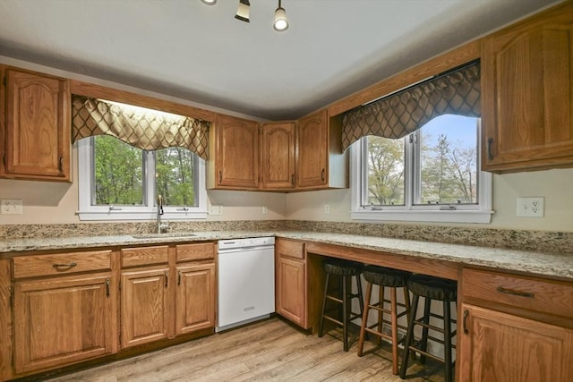 125 Chapin Rd Unit 3F, Hudson, MA 01749 - kitchen featuring a sink, white dishwasher, brown cabinetry, and light wood finished floors