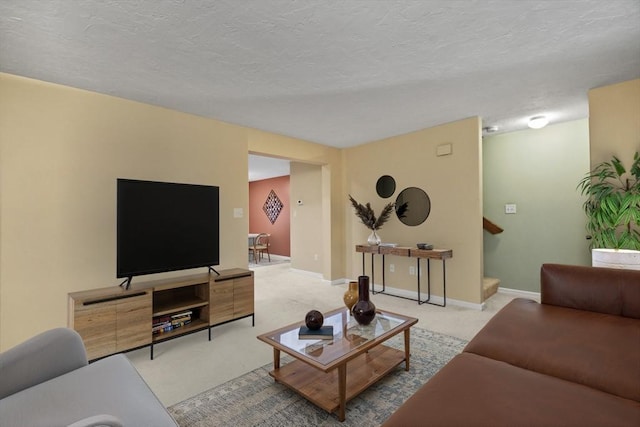 125 Chapin Rd Unit 3F, Hudson, MA 01749 - carpeted living room with stairway, a textured ceiling, and baseboards