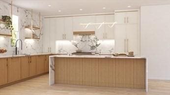 22 Irene Cir, Waltham, MA 02453 - kitchen featuring light wood-style flooring, light countertops, and recessed lighting