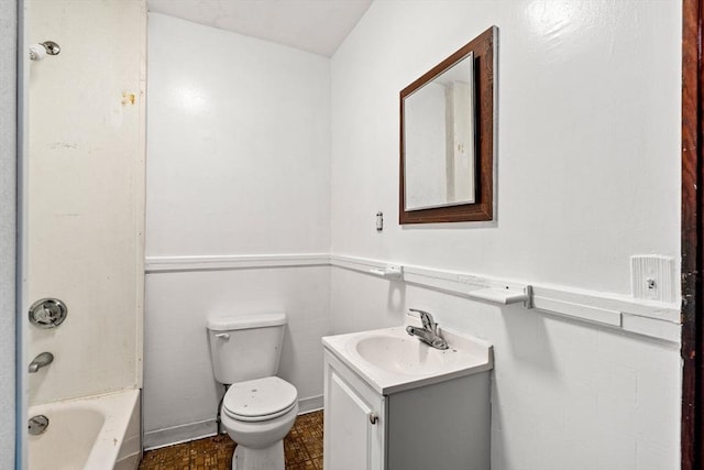 bathroom with toilet, vanity, and bathing tub / shower combination