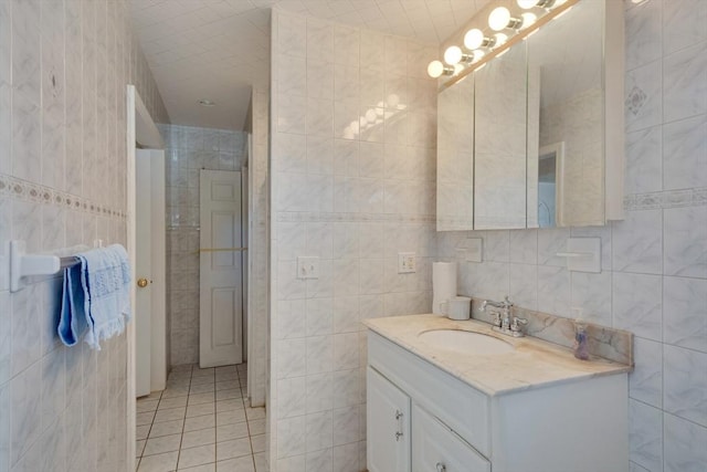 bathroom featuring vanity, tile walls, and tile patterned floors