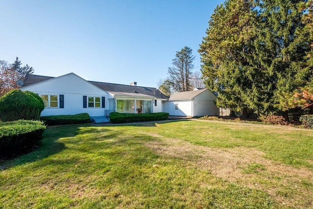 ranch-style house with a front lawn