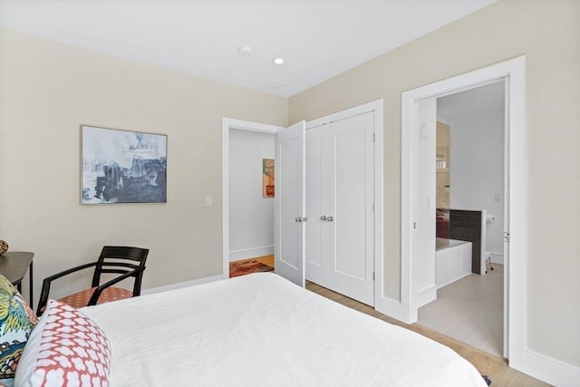 26 Salisbury Rd Unit 26, Newton, MA 02458 - bedroom with a closet, baseboards, wood finished floors, and recessed lighting
