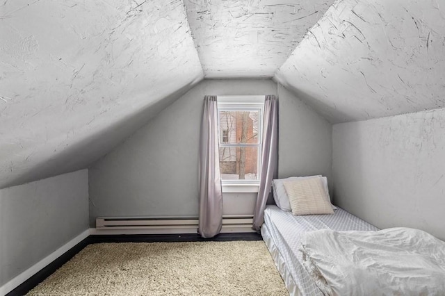 4 Ludington Rd, Worcester, MA 01602 - unfurnished bedroom featuring baseboard heating, vaulted ceiling, carpet, and baseboards
