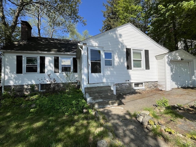 4 Ludington Rd, Worcester, MA 01602 - view of front of home featuring a chimney, an outdoor structure, and entry steps