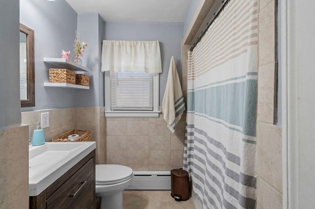 4 Ludington Rd, Worcester, MA 01602 - full bathroom featuring tile walls, baseboard heating, vanity, toilet, and tile patterned floors