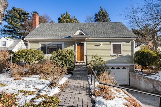 bungalow featuring a garage