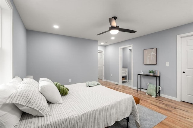 bedroom with light hardwood / wood-style flooring and ceiling fan