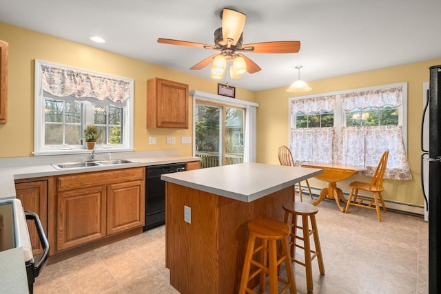 kitchen featuring electric stove, black dishwasher, a baseboard radiator, a sink, and a kitchen breakfast bar