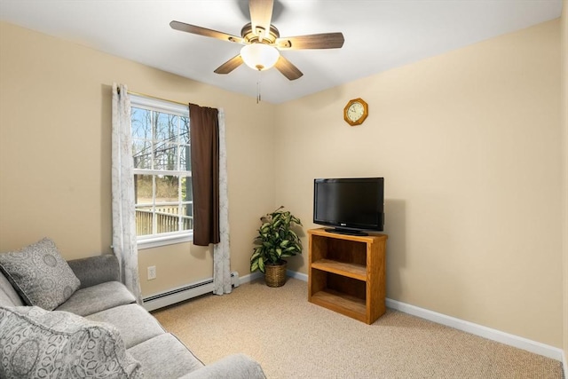 carpeted living area with a baseboard radiator, a ceiling fan, and baseboards