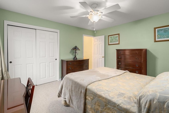 bedroom featuring a closet, carpet flooring, and a ceiling fan