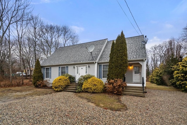 cape cod home with a shingled roof