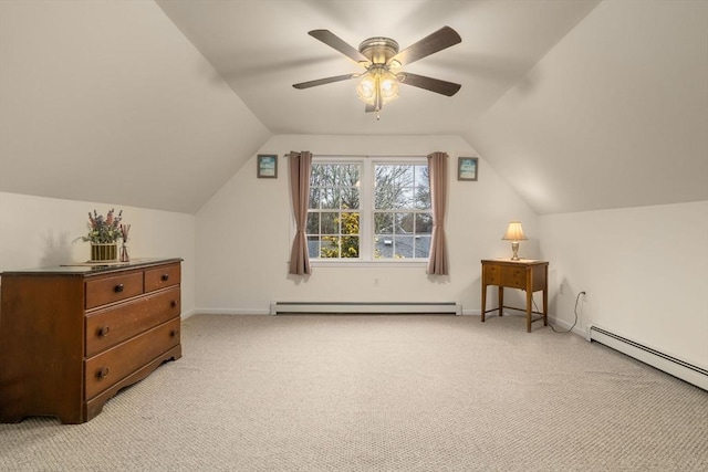 additional living space with light carpet, vaulted ceiling, and a baseboard radiator