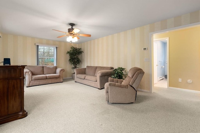 carpeted living area with baseboards, a baseboard heating unit, a ceiling fan, and wallpapered walls