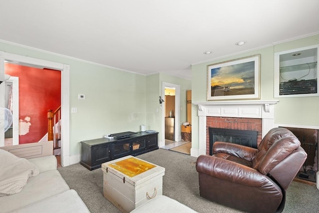 living room featuring carpet, a brick fireplace, and crown molding