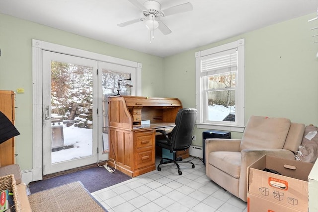 home office featuring light tile patterned floors, a baseboard heating unit, and a ceiling fan