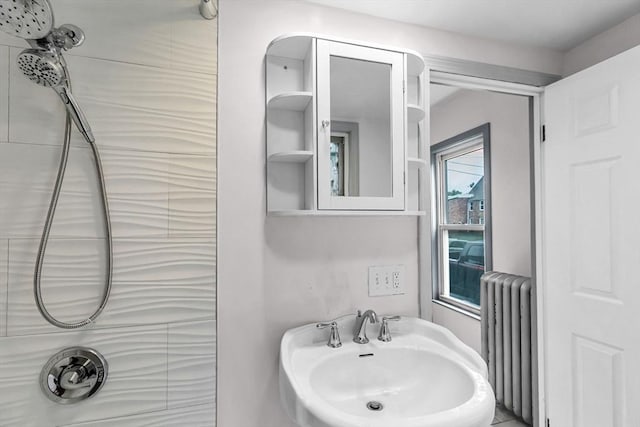 26 Olivine St, Chicopee, MA 01013 - bathroom featuring radiator and a sink