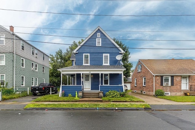 26 Olivine St, Chicopee, MA 01013 - view of front facade featuring covered porch