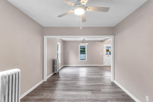 26 Olivine St, Chicopee, MA 01013 - unfurnished room with radiator, ceiling fan, and wood finished floors